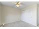 Bedroom features carpet, ceiling fan, and sliding door closet at 9526 Colony Pointe E Dr, Indianapolis, IN 46250