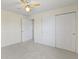 Bedroom featuring carpet, ceiling fan, and sliding closet door at 9526 Colony Pointe E Dr, Indianapolis, IN 46250
