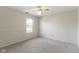 Neutral bedroom featuring carpet, window, and ceiling fan at 9526 Colony Pointe E Dr, Indianapolis, IN 46250