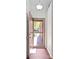 Entryway view, showing hardwood flooring, a light fixture and an open doorway into the house at 9526 Colony Pointe E Dr, Indianapolis, IN 46250