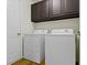 Laundry room featuring new washer and dryer with upper cabinets at 9526 Colony Pointe E Dr, Indianapolis, IN 46250