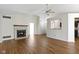 Bright living room featuring wood floors, vaulted ceilings, fireplace and open access to the kitchen at 9526 Colony Pointe E Dr, Indianapolis, IN 46250
