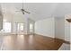 Bright living room featuring wood floors, vaulted ceilings, ceiling fan and natural light at 9526 Colony Pointe E Dr, Indianapolis, IN 46250