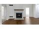 Bright living room featuring a charming fireplace and hardwood floors at 9526 Colony Pointe E Dr, Indianapolis, IN 46250