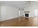 Spacious living room featuring wood floors, fireplace, and neutral paint at 9526 Colony Pointe E Dr, Indianapolis, IN 46250