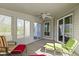 Enclosed sunroom with lots of windows allowing for plenty of light at 9526 Colony Pointe E Dr, Indianapolis, IN 46250
