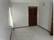 Carpeted bedroom with a built-in closet, natural light, and neutral walls creating a peaceful atmosphere at 1 Lenora Ave, Indianapolis, IN 46231