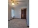 Cozy bedroom with gray walls, soft carpet, and a built-in closet offering a relaxing retreat at 1 Lenora Ave, Indianapolis, IN 46231