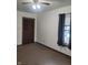 This bedroom features carpet floors, a ceiling fan and a window at 1 Lenora Ave, Indianapolis, IN 46231