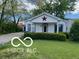 Inviting single-story home with a cozy porch and well-maintained landscaping, enhancing its charming appeal at 1 Lenora Ave, Indianapolis, IN 46231