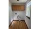 A laundry room with hardwood floors at 1 Lenora Ave, Indianapolis, IN 46231