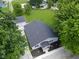 An aerial view of a charming home with a landscaped yard and detached two-car garage at 103 N Nebraska St, North Salem, IN 46165