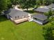 Aerial view of home featuring a spacious deck and large, detached two-car garage at 103 N Nebraska St, North Salem, IN 46165