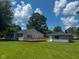 The backyard features a large deck, mature trees, and a detached garage at 103 N Nebraska St, North Salem, IN 46165