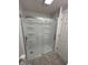 Bathroom shower with glass doors and tiled floor at 103 N Nebraska St, North Salem, IN 46165