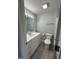 Bathroom with a modern single sink vanity and a tiled floor at 103 N Nebraska St, North Salem, IN 46165