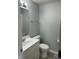 A modern half bath features new vanity and fixtures at 103 N Nebraska St, North Salem, IN 46165