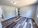 Stylish bedroom with wood-look floors, offering a tranquil retreat with adjacent bathroom access at 103 N Nebraska St, North Salem, IN 46165