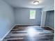 Inviting bedroom with modern flooring and a large window, offering natural light at 103 N Nebraska St, North Salem, IN 46165