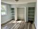 Bedroom features a closet with bi-fold doors, built-in shelves and a window at 103 N Nebraska St, North Salem, IN 46165
