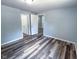 Comfortable bedroom with modern floors and neutral walls provides a calming retreat at 103 N Nebraska St, North Salem, IN 46165