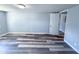 Cozy bedroom with wood-look flooring and ample natural light, ready for relaxation at 103 N Nebraska St, North Salem, IN 46165