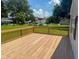 Wooden deck featuring a view of the surrounding greenery and neighboring houses at 103 N Nebraska St, North Salem, IN 46165