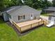 New wooden deck with railing offers a great space for entertaining in the backyard at 103 N Nebraska St, North Salem, IN 46165