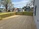 Large wooden deck with a view of the backyard and surrounding neighborhood at 103 N Nebraska St, North Salem, IN 46165