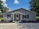 Well-maintained home features a covered entryway, updated landscaping, and charming curb appeal at 103 N Nebraska St, North Salem, IN 46165