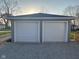 Two-car detached garage with white doors and gray brick exterior at 103 N Nebraska St, North Salem, IN 46165