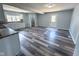 Bright kitchen with white cabinets, modern appliances, and sleek flooring at 103 N Nebraska St, North Salem, IN 46165