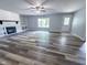 Spacious living room with fireplace, built-in shelves, large windows, and stylish flooring at 103 N Nebraska St, North Salem, IN 46165