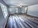 An open-concept living room featuring sleek modern flooring and neutral paint at 103 N Nebraska St, North Salem, IN 46165