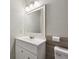 This bathroom features a white sink vanity with a mirror and modern lighting fixture at 10881 August Dr, Ingalls, IN 46048
