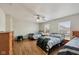 Spacious bedroom with hardwood floors, ceiling fan, with plenty of natural light from the windows at 10881 August Dr, Ingalls, IN 46048
