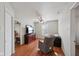 Bedroom features a dresser, ceiling fan, sitting chair and hardwood floors at 10881 August Dr, Ingalls, IN 46048