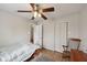 Bedroom featuring a bed, ceiling fan, closet and hardwood floors at 10881 August Dr, Ingalls, IN 46048