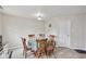 Bright dining area with hardwood floors, table and chairs, and natural light at 10881 August Dr, Ingalls, IN 46048