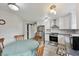 Bright kitchen with white cabinets, stainless steel appliances, and dining table at 10881 August Dr, Ingalls, IN 46048