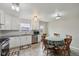 Updated kitchen and dining area with white cabinets and stainless steel appliances at 10881 August Dr, Ingalls, IN 46048