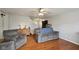 Inviting living room featuring a ceiling fan, hardwood floors and comfortable seating at 10881 August Dr, Ingalls, IN 46048