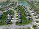 Stunning aerial view of a residential neighborhood with lush green spaces, ponds, and well-maintained homes at 11014 Woodpark Dr, Noblesville, IN 46060