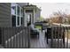 A view of the backyard deck furnished with a comfortable seating arrangement at 11014 Woodpark Dr, Noblesville, IN 46060