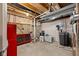 Unfinished basement with workbench, storage, and utility equipment at 11014 Woodpark Dr, Noblesville, IN 46060