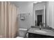 Bathroom featuring a granite vanity top, neutral paint and a shower/tub with curtain at 11014 Woodpark Dr, Noblesville, IN 46060