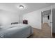 Well-lit bedroom with neutral tones and adjacent hallway at 11014 Woodpark Dr, Noblesville, IN 46060