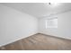 Minimalist bedroom with neutral carpeting and natural light from a window at 11014 Woodpark Dr, Noblesville, IN 46060