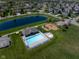 Scenic aerial view featuring a pool, playground, and pond, showcasing the community's recreational amenities at 11014 Woodpark Dr, Noblesville, IN 46060