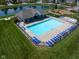 Inviting community pool area with plenty of lounge chairs and a clubhouse for residents to enjoy at 11014 Woodpark Dr, Noblesville, IN 46060